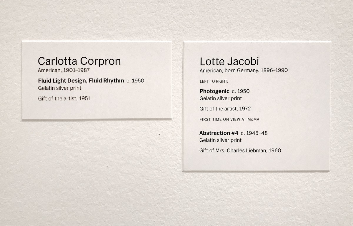 Wall labels for Carlotta Corpron and Lotte Jacobi photographs in MoMA's collection galleries